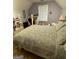 Bright bedroom with a window view, desk, and comfortable bed at 374 Persimmon Dr, Sharpsburg, GA 30277