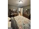 Comfortable bedroom with a desk, mirror, and well-lit at 374 Persimmon Dr, Sharpsburg, GA 30277