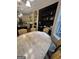 An eat-in dining area featuring an antique table and black study nook is conveniently located off the kitchen at 374 Persimmon Dr, Sharpsburg, GA 30277