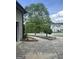 Long driveway leading to a large home with a lush green lawn and manicured landscaping at 374 Persimmon Dr, Sharpsburg, GA 30277