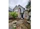 Charming brick home featuring a walkway leading to the front entrance at 374 Persimmon Dr, Sharpsburg, GA 30277