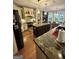 Bright kitchen with a stone countertop island and stainless steel appliances at 374 Persimmon Dr, Sharpsburg, GA 30277