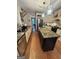 Spacious kitchen featuring an island, stainless appliances, and modern lighting at 374 Persimmon Dr, Sharpsburg, GA 30277