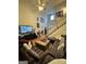 Soaring ceilings and staircase create a grand scale in the living room with lots of natural light at 374 Persimmon Dr, Sharpsburg, GA 30277