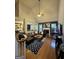 The open-concept living room with fireplace seamlessly connects to the kitchen and dining area at 374 Persimmon Dr, Sharpsburg, GA 30277