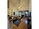 Open living room with soaring ceilings and fireplace flows into the kitchen, creating a spacious atmosphere at 374 Persimmon Dr, Sharpsburg, GA 30277