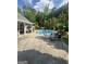 Open patio area featuring a pool with patio seating and green surroundings at 374 Persimmon Dr, Sharpsburg, GA 30277