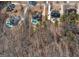 Aerial view of adjacent properties with back yard pools; this lot indicated with yellow arrow at 108 Turnberry Trce, Sharpsburg, GA 30277