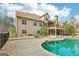 Beautiful backyard with a sparkling pool, mature trees, and landscaped areas at 108 Turnberry Trce, Sharpsburg, GA 30277
