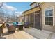 Spacious outdoor deck with comfortable lounge seating, offering a relaxing space for enjoying the beautiful backyard surroundings at 108 Turnberry Trce, Sharpsburg, GA 30277