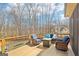 Open air deck area featuring comfortable outdoor furniture and views of the yard and surrounding neighborhood at 108 Turnberry Trce, Sharpsburg, GA 30277