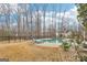 Relax in this backyard featuring a large in-ground pool and an outdoor oasis at 108 Turnberry Trce, Sharpsburg, GA 30277