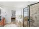 Bathroom showcasing a walk-in shower with tile surround, a soaking tub, and access to the main bedroom at 108 Turnberry Trce, Sharpsburg, GA 30277
