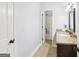Bathroom featuring a vanity with granite counters and a view of the bath tub at 108 Turnberry Trce, Sharpsburg, GA 30277