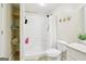 The bathroom features neutral walls, tile flooring, a toilet, a shower-tub combination and a shelf for storage at 108 Turnberry Trce, Sharpsburg, GA 30277