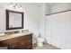 Bathroom featuring a granite vanity, dark cabinets, and a shower-tub combo at 108 Turnberry Trce, Sharpsburg, GA 30277