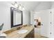 Bathroom featuring granite vanity and an open doorway to a bedroom at 108 Turnberry Trce, Sharpsburg, GA 30277