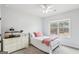 Bright bedroom with natural light, a plush bed, and serene decor, creating a comfortable and inviting retreat at 108 Turnberry Trce, Sharpsburg, GA 30277