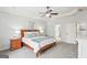 Bedroom featuring a tray ceiling, neutral color palette, and ensuite bathroom at 108 Turnberry Trce, Sharpsburg, GA 30277