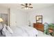 Spacious bedroom with soft carpet and a glimpse of the hall through a doorway at 108 Turnberry Trce, Sharpsburg, GA 30277