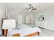 Bright bedroom with neutral colors, tray ceiling, a television on the dresser and a large window at 108 Turnberry Trce, Sharpsburg, GA 30277