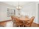 Traditional dining room with wood table, chairs and large windows at 108 Turnberry Trce, Sharpsburg, GA 30277