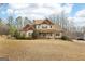 Beautiful two-story home with great curb appeal, a well-manicured lawn, and an inviting front porch at 108 Turnberry Trce, Sharpsburg, GA 30277