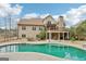 Spacious two-story home with a large backyard pool, upper and lower decks, and manicured landscaping at 108 Turnberry Trce, Sharpsburg, GA 30277