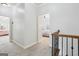 Hallway with carpeted floors and access to multiple bedrooms at 108 Turnberry Trce, Sharpsburg, GA 30277