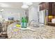 Kitchen island with granite countertops, stainless steel sink and modern faucet at 108 Turnberry Trce, Sharpsburg, GA 30277