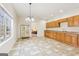 Spacious carpeted kitchenette with wood cabinets, ample counter space, and large window at 108 Turnberry Trce, Sharpsburg, GA 30277