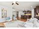 Bright open-concept living space featuring a fireplace and modern decor at 108 Turnberry Trce, Sharpsburg, GA 30277