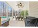 Inviting covered patio with dining table, ceiling fans, and views of the pool at 108 Turnberry Trce, Sharpsburg, GA 30277
