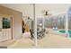 Spacious covered patio features an outdoor dining area with a view of the pool at 108 Turnberry Trce, Sharpsburg, GA 30277