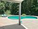 Inviting backyard pool area with lounge chairs and a tranquil wooded backdrop at 108 Turnberry Trce, Sharpsburg, GA 30277