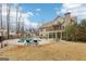 A beautiful backyard with a pool and lounge chairs, perfect for relaxing and entertaining at 108 Turnberry Trce, Sharpsburg, GA 30277