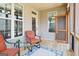 Charming porch with seating and a decorative rug, perfect for enjoying the outdoors and relaxing in style at 108 Turnberry Trce, Sharpsburg, GA 30277