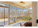 Inviting screened porch with ceiling fan and scenic backyard view offers a tranquil space for relaxation and entertaining at 108 Turnberry Trce, Sharpsburg, GA 30277