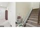 Stairway with carpeted stairs and a stair lift at 108 Turnberry Trce, Sharpsburg, GA 30277