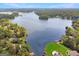 Breathtaking aerial view of a lake surrounded by beautiful homes and lush greenery at 2019 Emerald Dr, Jonesboro, GA 30236