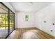 Bedroom featuring luxury vinyl floors, a sliding glass door and a window providing ample natural light at 2019 Emerald Dr, Jonesboro, GA 30236