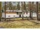 Inviting front exterior of a two-story home featuring a landscaped yard and mature trees at 2019 Emerald Dr, Jonesboro, GA 30236