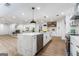 Bright, open kitchen showcasing an island with waterfall countertops and a seamless connection to living spaces at 2019 Emerald Dr, Jonesboro, GA 30236