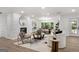 Bright living room featuring a brick fireplace and an open floor plan with modern furnishings at 2019 Emerald Dr, Jonesboro, GA 30236