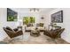 Stylish living room featuring comfortable seating, modern decor, and a serene backyard view at 2019 Emerald Dr, Jonesboro, GA 30236