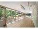 Bright sunroom featuring walls of windows offering scenic views of the lush outdoors at 2019 Emerald Dr, Jonesboro, GA 30236