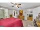 Inviting bedroom with hardwood floors and a view to the bathroom at 7616 Nicholson Rd, Cumming, GA 30028