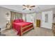 Comfortable bedroom with carpet, ceiling fan, and access to a bathroom at 7616 Nicholson Rd, Cumming, GA 30028