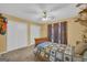 Cozy bedroom features a ceiling fan and large closet, providing a comfortable and well-organized living space at 7616 Nicholson Rd, Cumming, GA 30028