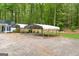 Two carports providing sheltered parking at 7616 Nicholson Rd, Cumming, GA 30028